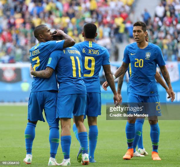 Philippe Coutinho of Brazil celebrates with teammate Douglas Costa after scoring his team's first goal during the 2018 FIFA World Cup Russia group E...