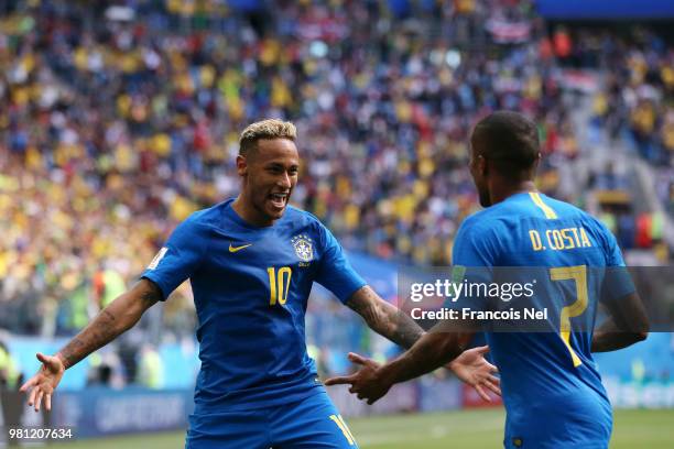 Neymar Jr of Brazil celebrates with teammate Douglas Costa after scoring his team's second goal during the 2018 FIFA World Cup Russia group E match...