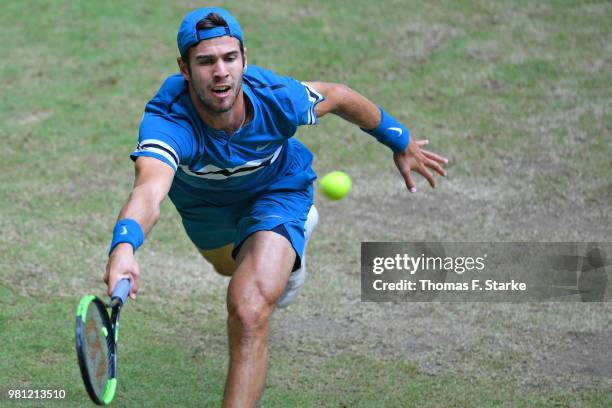Karen Khachanov of Russia plays a backhand in his match against Roberto Bautista Agut of Spain during day five of the Gerry Weber Open at Gerry Weber...