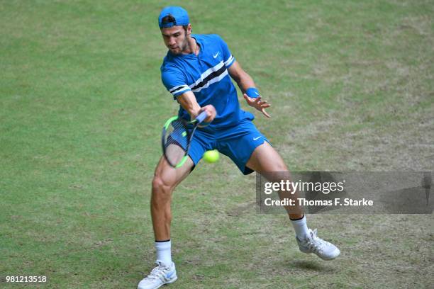 Karen Khachanov of Russia plays a backhand in his match against Roberto Bautista Agut of Spain during day five of the Gerry Weber Open at Gerry Weber...