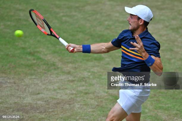 Roberto Bautista Agut of Spain plays a backhand in his match against Karen Khachanov of Russia during day five of the Gerry Weber Open at Gerry Weber...