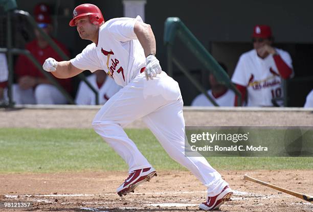 Matt Holliday of the St. Louis Cardinals runs to first base during a game against the Baltimore Orioles at Roger Dean Stadium on March 24, 2010 in...