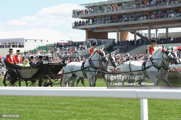 Queen Elizabeth II, David Armstrong-Jones, Earl of Snowdon, Peter Troughton and John Warren arrive in the Royal procession on day 4 of Royal Ascot at...