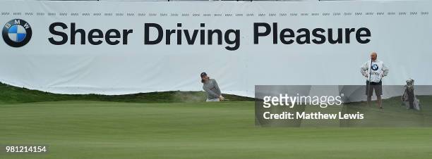 Tommy Fleetwood of England plays out of a bunker on the 18th hole during day two of the BMW International Open at Golf Club Gut Larchenhof on June...
