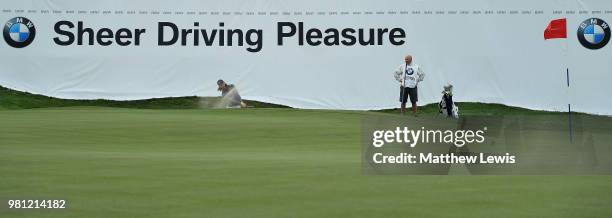 Tommy Fleetwood of England plays out of a bunker on the 18th hole during day two of the BMW International Open at Golf Club Gut Larchenhof on June...