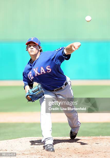 Wilson of the Texas Rangers pitches during a Spring Training game against the Chicago Cubs on March 16, 2010 at HoHoKam Park in Mesa, Arizona.