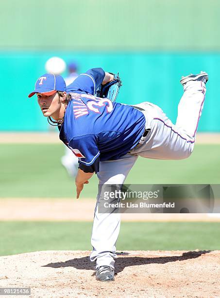 Wilson of the Texas Rangers pitches during a Spring Training game against the Chicago Cubs on March 16, 2010 at HoHoKam Park in Mesa, Arizona.