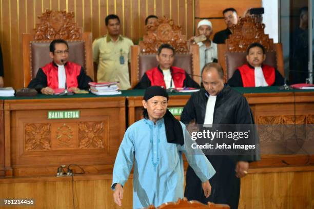 Defendant of terrorism case of Aman Abdurrahman, also known as Oman, before undergoing hearing of decision on him in South Jakarta District Court,...