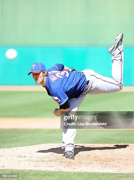 Wilson of the Texas Rangers pitches during a Spring Training game against the Chicago Cubs on March 16, 2010 at HoHoKam Park in Mesa, Arizona.