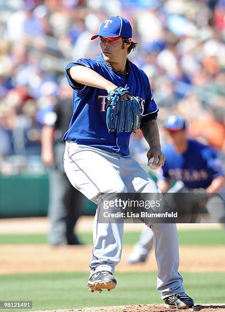 Wilson of the Texas Rangers pitches during a Spring Training game against the Chicago Cubs on March 16, 2010 at HoHoKam Park in Mesa, Arizona.