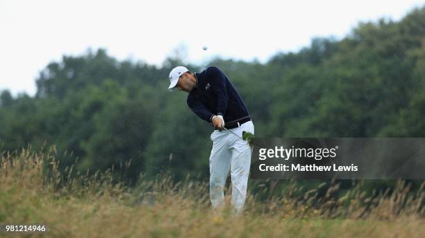 Martin Kaymer of Germnay plays out of the rough on the 6th hole during day two of the BMW International Open at Golf Club Gut Larchenhof on June 22,...