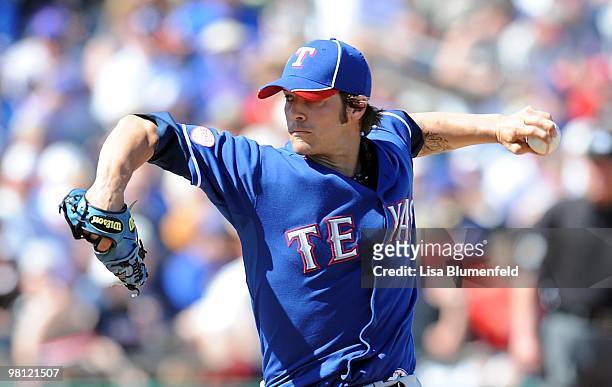 Wilson of the Texas Rangers pitches during a Spring Training game against the Chicago Cubs on March 16, 2010 at HoHoKam Park in Mesa, Arizona.