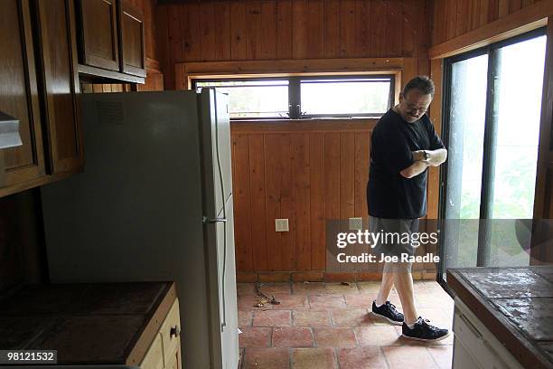 David Sandlin checks out the kitchen in a short sale home on March 29, 2010 in Miami, Florida. On April 5, 2010 lenders and mortgage investors will...