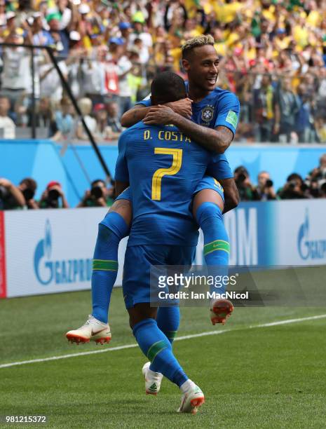 Neymar of Brazil celebrates with Douglas Costa of Brazil after scoring his team's second goal during the 2018 FIFA World Cup Russia group E match...