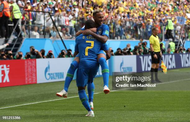 Neymar of Brazil celebrates with Douglas Costa of Brazil after scoring his team's second goal during the 2018 FIFA World Cup Russia group E match...