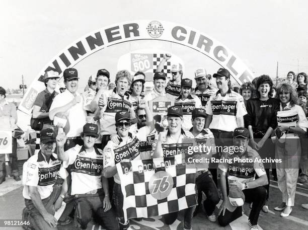 Benny Parsons and his crew take photos in Victory Lane after winning the Coca-Cola 500. Parsons would take home $51,110 for the win.