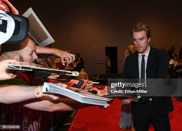 Connor McDavid of the Edmonton Oilers signs autographs for fans as he arrives at the 2018 NHL Awards presented by Hulu at the Hard Rock Hotel &...