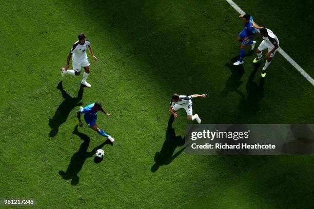 Douglas Costa of Brazil is challenged by Bryan Ruiz and Bryan Oviedo of Costa Rica during the 2018 FIFA World Cup Russia group E match between Brazil...