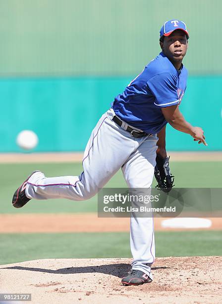 Neftali Feliz of the Texas Rangers pitches during a Spring Training game against the Chicago Cubs on March 16, 2010 at HoHoKam Park in Mesa, Arizona.