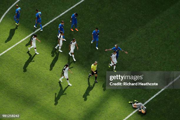 Keylor Navas of Costa Rica goes down injured, and Neymar Jr of Brazil confronts referee Bjorn Kuipers as he goes to check on Keylor Navas during the...