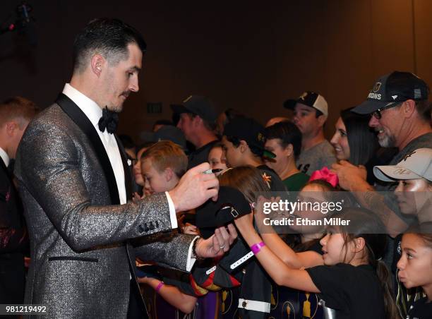 Brian Boyle of the New Jersey Devils signs autographs for fans as he arrives at the 2018 NHL Awards presented by Hulu at the Hard Rock Hotel & Casino...