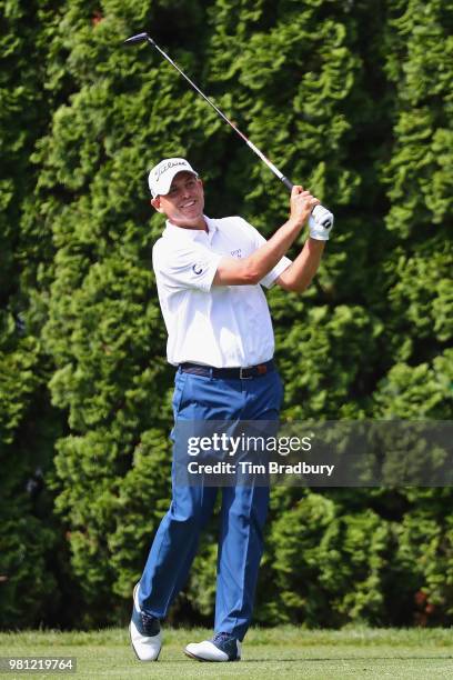 Bill Haas of the United States plays his shot from the ninth tee during the second round of the Travelers Championship at TPC River Highlands on June...