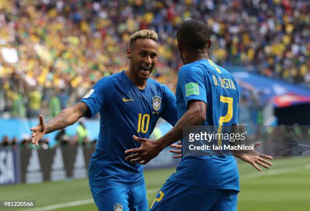 Neymar of Brazil celebrates with Douglas Costa of Brazil after scoring his team's second goal during the 2018 FIFA World Cup Russia group E match...
