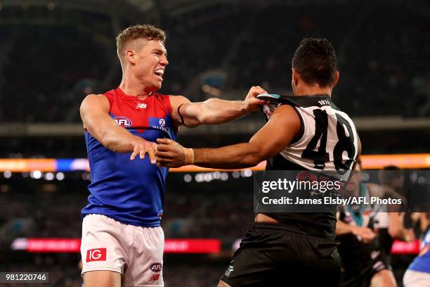 Jake Melksham of the Demons clashes with Lindsay Thomas of the Power during the 2018 AFL round 14 match between the Port Adelaide Power and the...