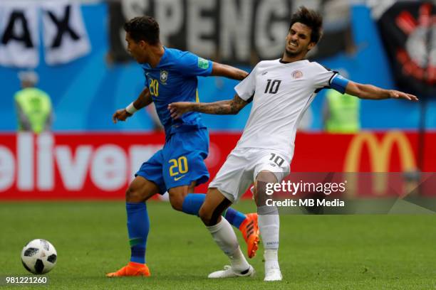 Roberto Firmino of Brazil national team and Bryan Ruiz of Costa Rica national team vie for the ball during the 2018 FIFA World Cup Russia group E...