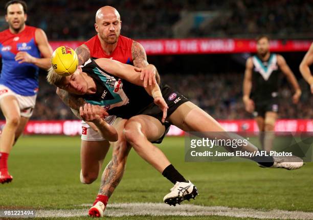 Nathan Jones of the Demons tackles Todd Marshall of the Power during the 2018 AFL round 14 match between the Port Adelaide Power and the Melbourne...