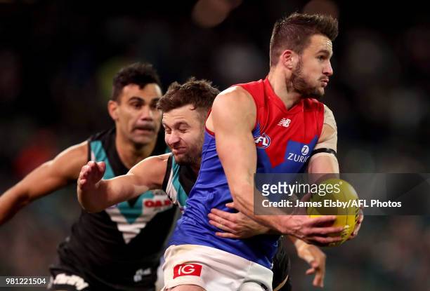 Sam Gray of the Power tackles Joel Smith of the Demons during the 2018 AFL round 14 match between the Port Adelaide Power and the Melbourne Demons at...
