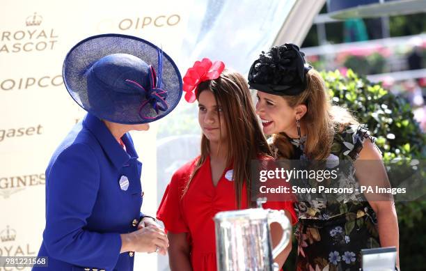 Princess Haya of Jordan and daughter Sheikha Al Jalila bint Mohammad bin Rashid al Maktoum are presented with a trophy by Clare Balding after winning...