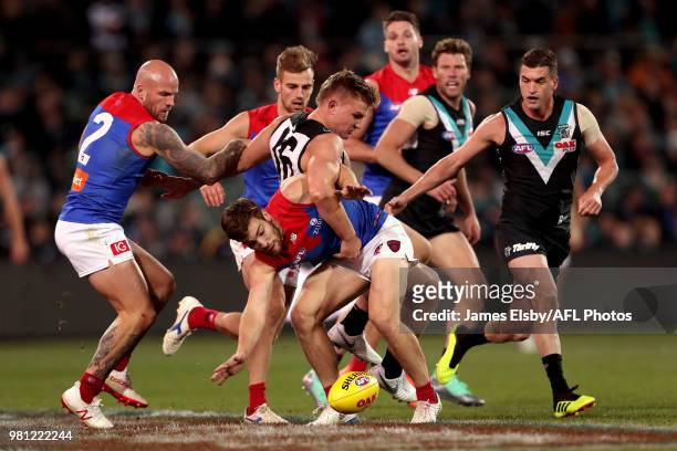 Ollie Wines of the Power tackles Jack Viney of the Demons during the 2018 AFL round 14 match between the Port Adelaide Power and the Melbourne Demons...