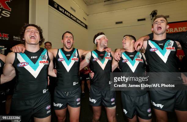 The Power celebrate their win during the 2018 AFL round 14 match between the Port Adelaide Power and the Melbourne Demons at Adelaide Oval on June...
