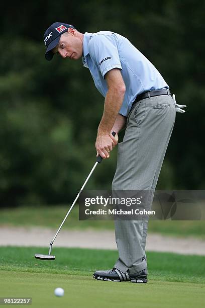 Jim Furyk strokes his birdie putt on the third hole during the final round of the Transitions Championship at the Innisbrook Resort and Golf Club...