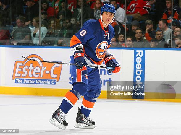 Richard Park of the New York Islanders skates against the New Jersey Devils on March 13, 2010 at Nassau Coliseum in Uniondale, New York. Islanders...