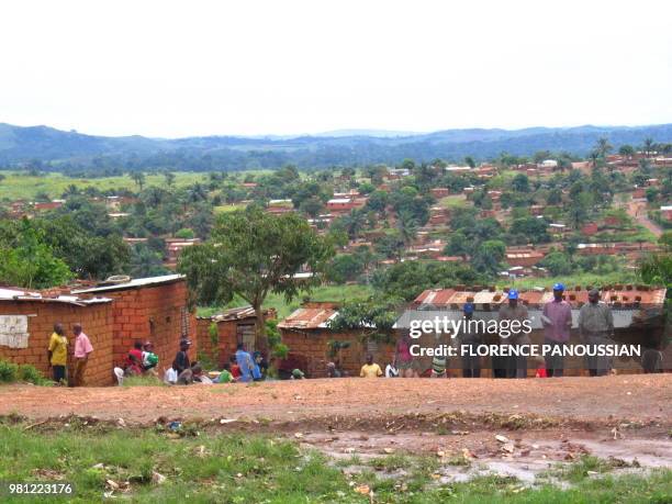World health Organization epidemic specialists visit a shanty town after an outbreak of the deadly Marburg virus in Angola 10 April 2005, in Uige....