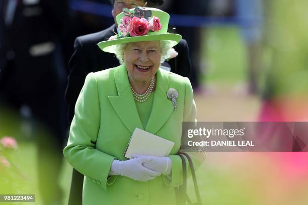 Britain's Queen Elizabeth II reacts as she attends day four of the Royal Ascot horse racing meet, in Ascot, west of London, on June 22, 2018. The...