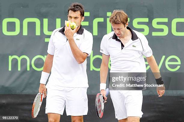 Nenad Zimonjic of Serbia and Daniel Nestor of Canada play against Nicolas Almagro and Tommy Roberdo of Spain during day seven of the 2010 Sony...