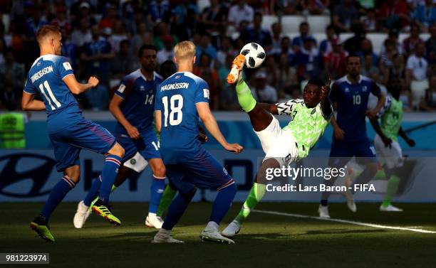 Oghenekaro Etebo of Nigeria attempts an overhead kick under pressure of Hordur Magnusson and Alfred Finnbogason of Iceland during the 2018 FIFA World...