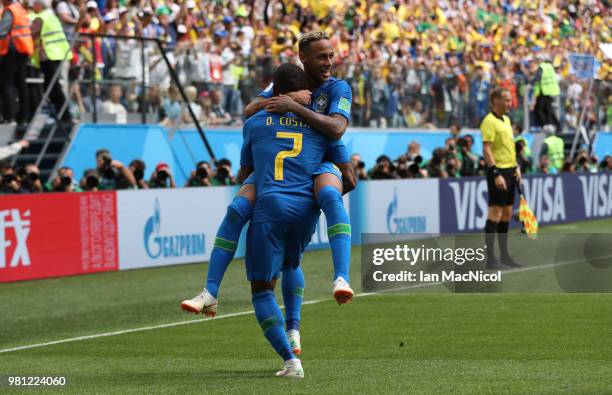 Neymar of Brazil celebrates with Douglas Costa of Brazil after scoring his team's second goal during the 2018 FIFA World Cup Russia group E match...