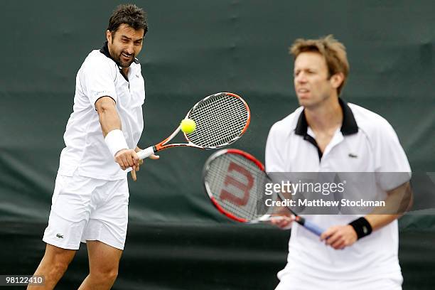 Nenad Zimonjic of Serbia and Daniel Nestor of Canada play against Nicolas Almagro and Tommy Roberdo of Spain during day seven of the 2010 Sony...