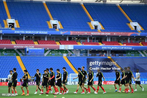 Players of South Korea warm up during a training and press conference ahead of the match against Mexico as part of FIFA World Cup Russia 2018 at...