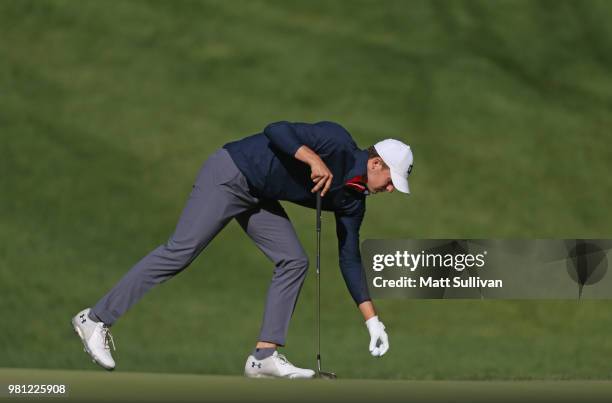 Jordan Spieth lines up a putt on the 11th hole during the second round of the Travelers Championship at TPC River Highlands on June 22, 2018 in...