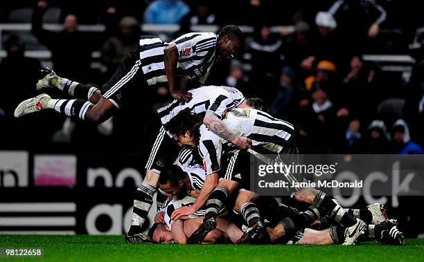 Players of Newcastle celebrate the goal of Jose Enrique of Newcastle United during the Coca-Cola Championship match between Newcastle United and...