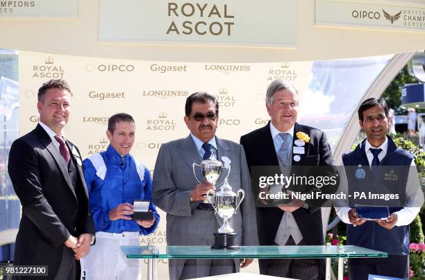 Owner Hamdan Al Maktoum, Trainer Sir Michael Stoute and Jockey Jim Crowley are presented with their trophies by Michael Owen after winning the...