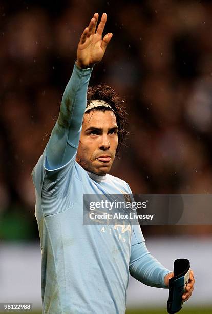 Carlos Tevez of Manchester City celebrates scoring the opening goal during the Barclays Premier League match between Manchester City and Wigan...