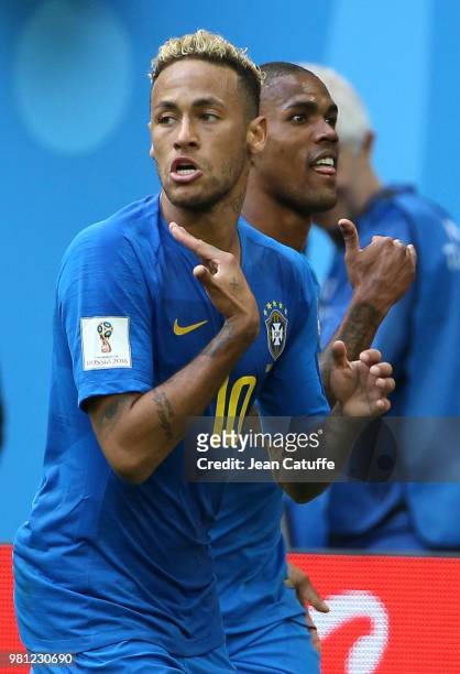 Neymar Jr of Brazil celebrates scoring the second goal of his team with Douglas Costa during the 2018 FIFA World Cup Russia group E match between...