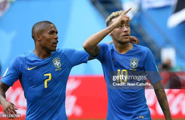 Neymar Jr of Brazil celebrates scoring the second goal of his team with Douglas Costa during the 2018 FIFA World Cup Russia group E match between...