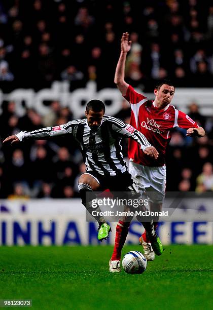 Wayne Routledge of Newcastle United battles with Paul Anderson of Nottingham Forest during the Coca-Cola Championship match between Newcastle United...